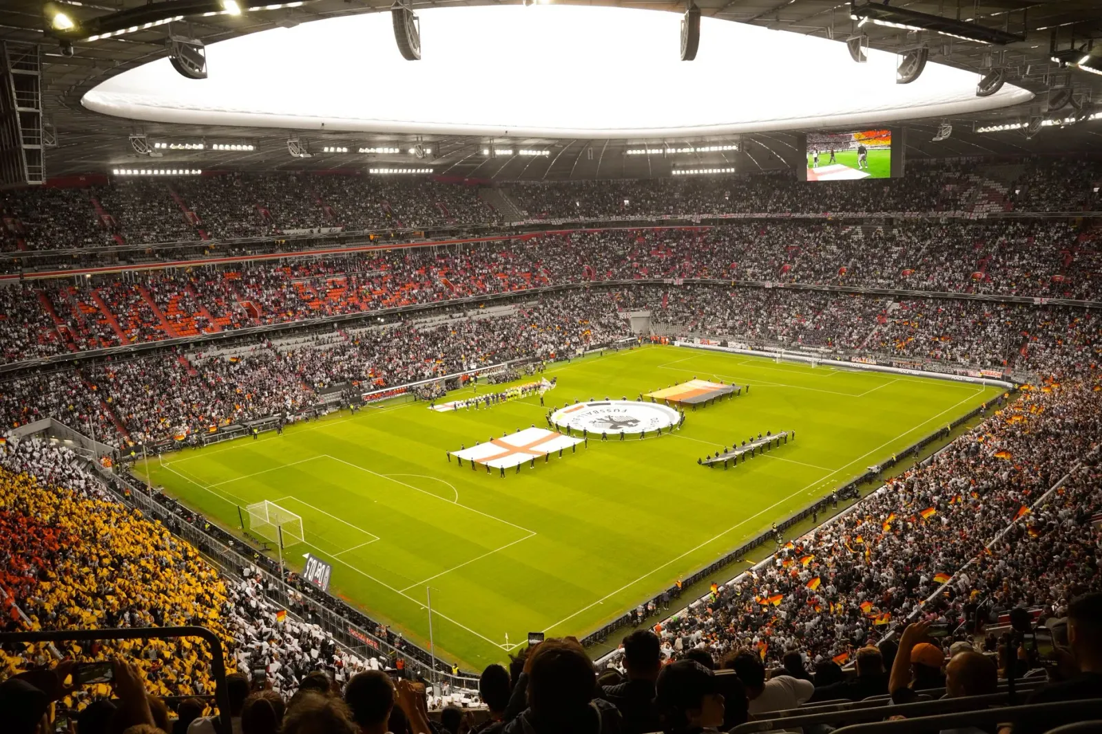 Imajen estadiu futuru ho luz neon, hatudu mudansa teknolojia no poder iha desportu globál agora